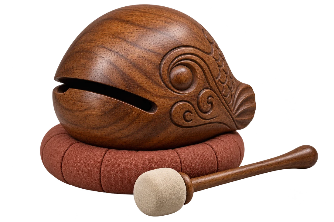 Carved wooden fish and mallet